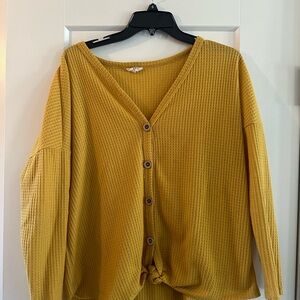 Waffle knit top with front tie.